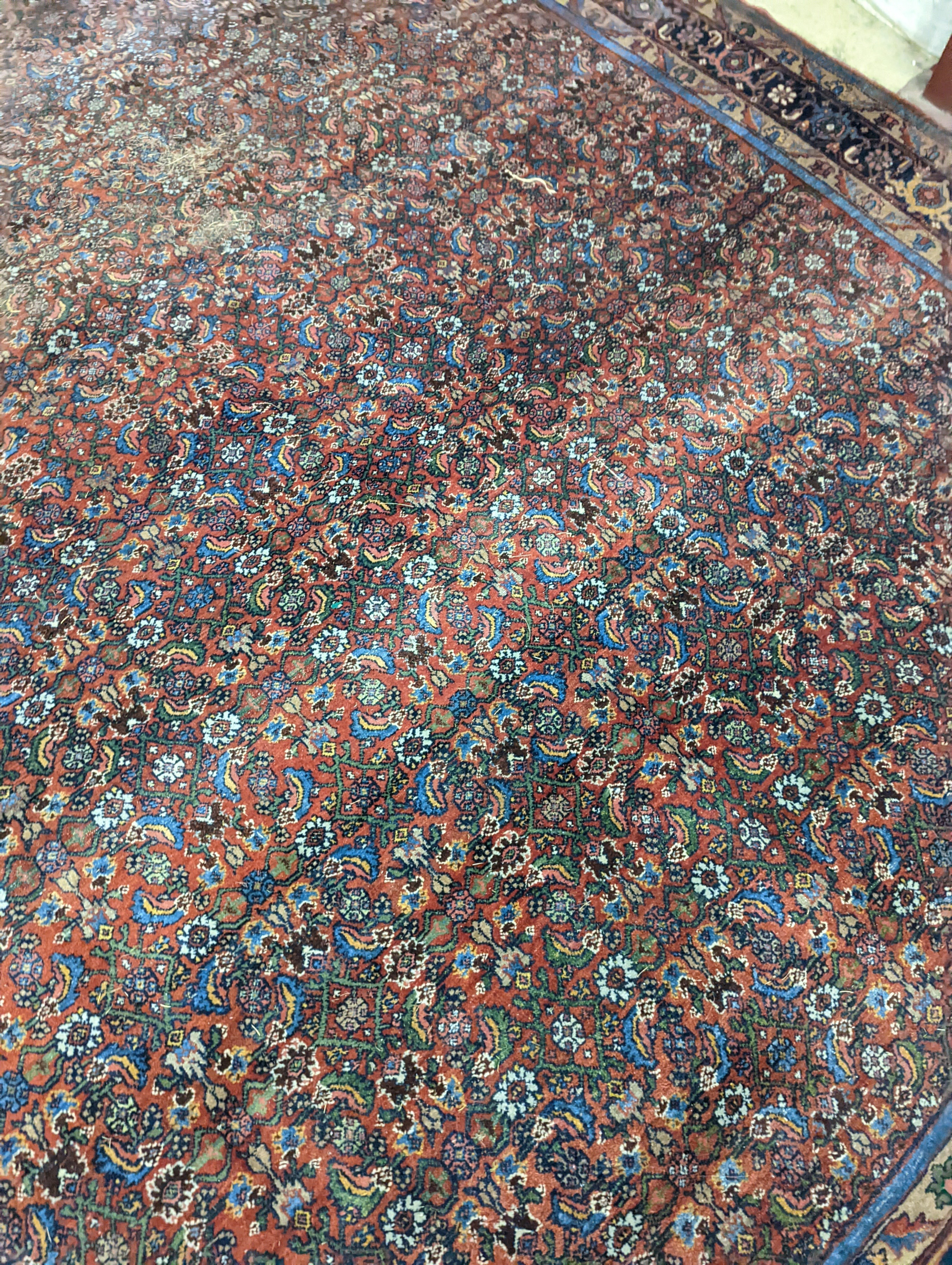 A North West Persian red ground carpet, 360 x 250cm